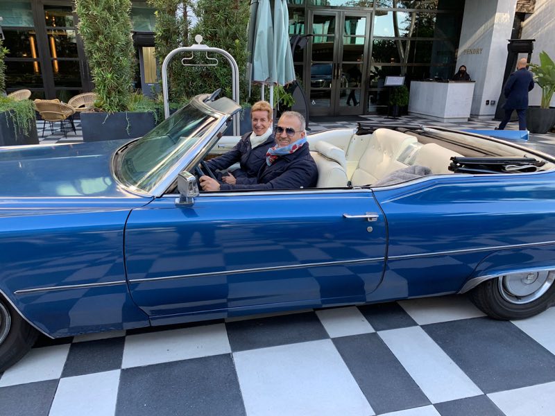 White interior of the blue 1970 Cadillac DeVille convertible with the top down