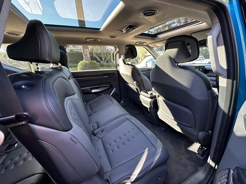 Rear seats and panoramic roof inside the private tour SUV