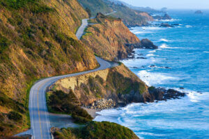 Aerial view of the Pacific Coast Highway along the water.