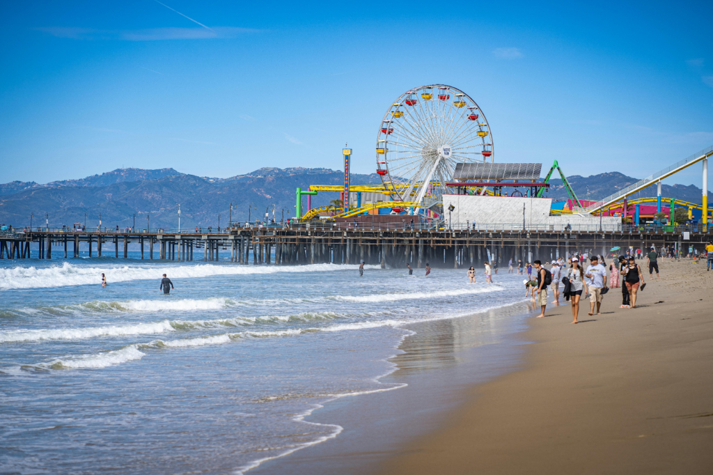 Santa Monica Pier and its Ferris wheel above the beach and surf